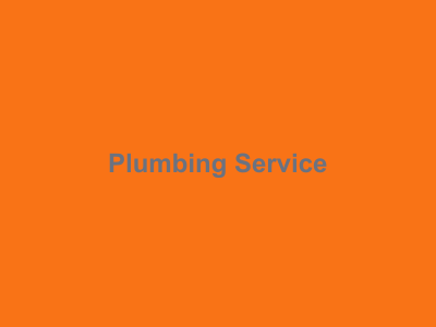 Plumber working on pipes and fittings
